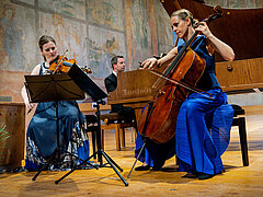 Trio of musicians Eberle, Gabetta and Chamayou playing in the church in Saanen.